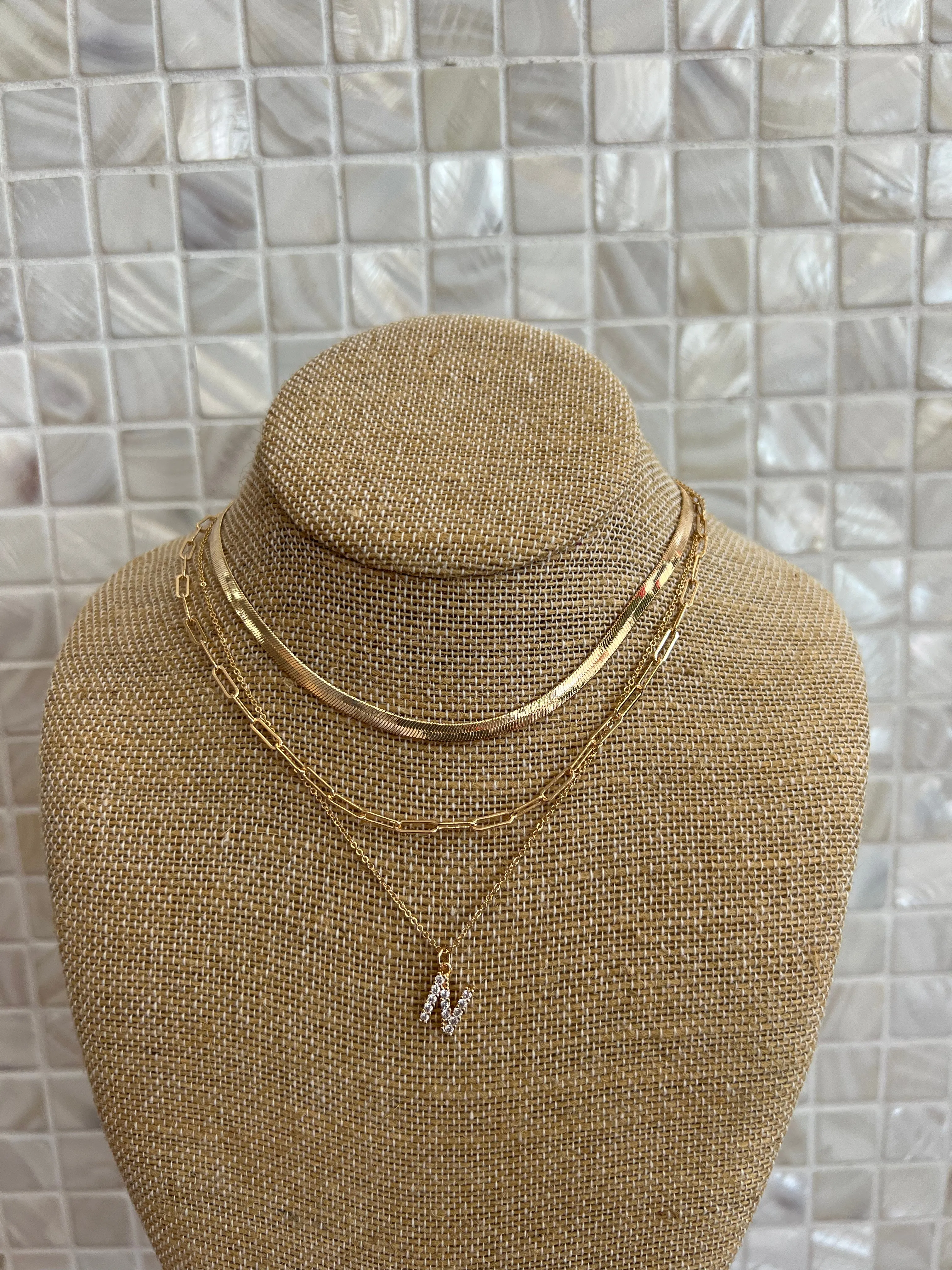 GOLD SNAKE, PAPERCLIP, AND CRYSTAL PENDANT INITIAL LAYERED NECKLACE