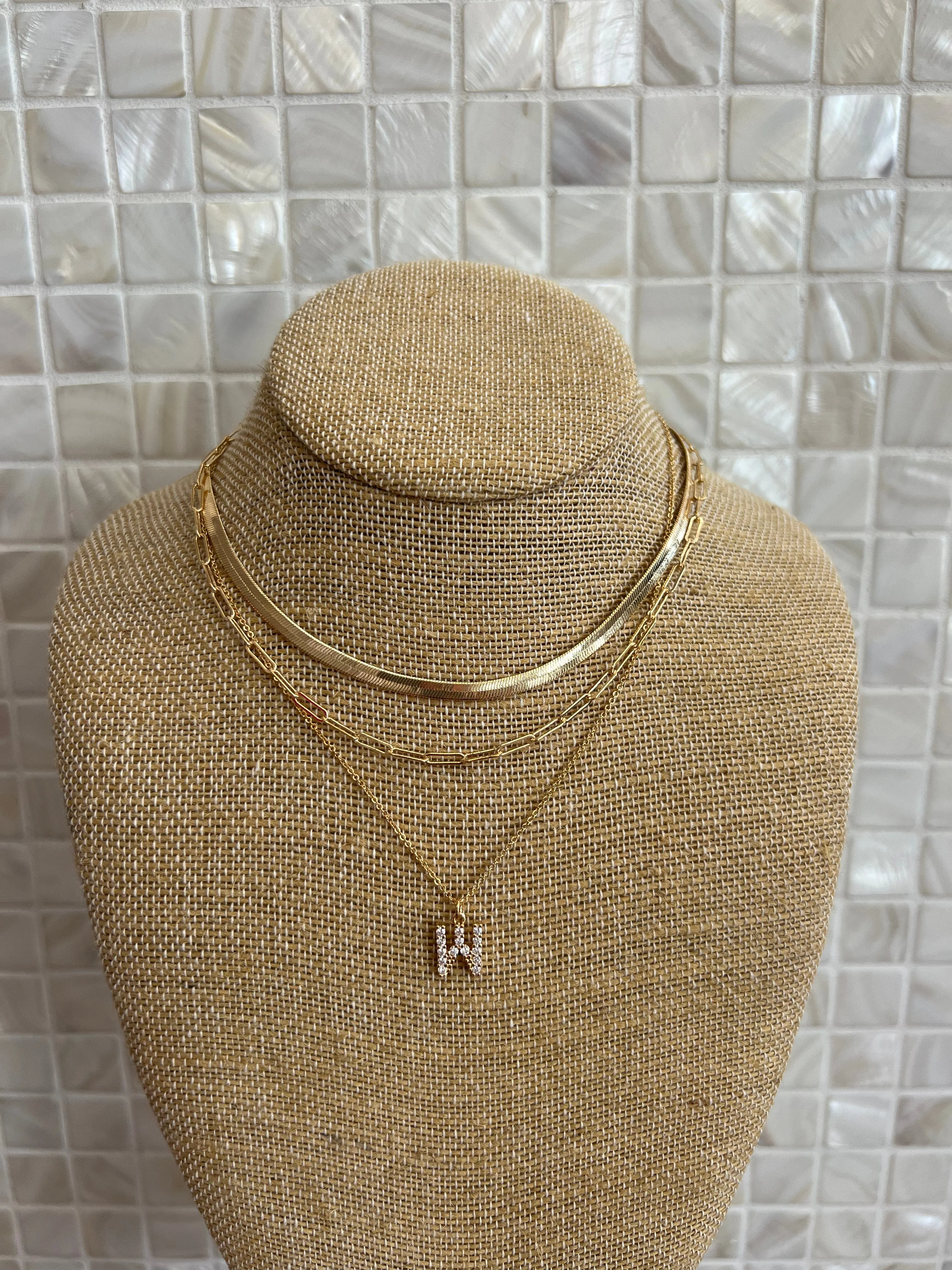 GOLD SNAKE, PAPERCLIP, AND CRYSTAL PENDANT INITIAL LAYERED NECKLACE