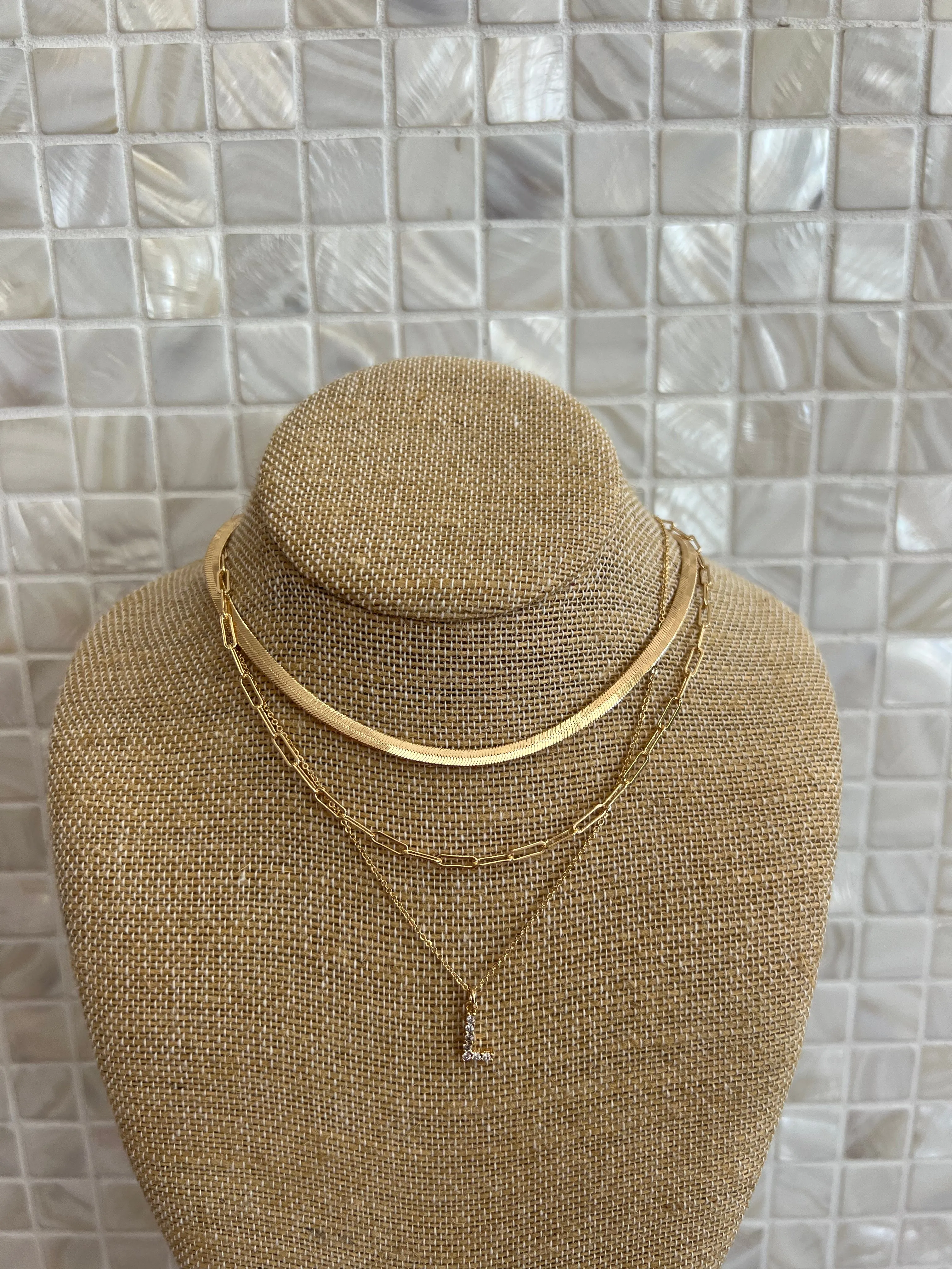 GOLD SNAKE, PAPERCLIP, AND CRYSTAL PENDANT INITIAL LAYERED NECKLACE