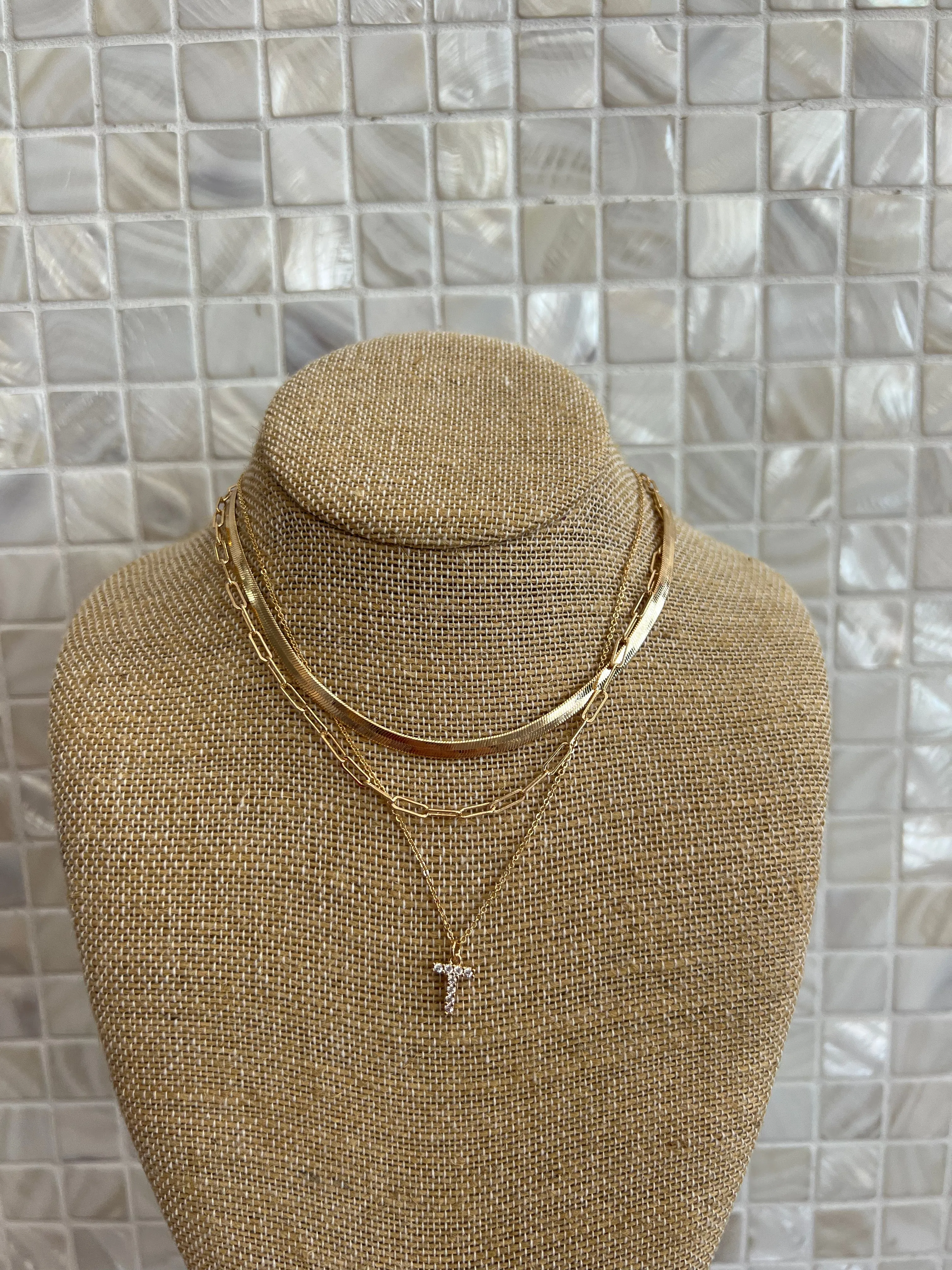 GOLD SNAKE, PAPERCLIP, AND CRYSTAL PENDANT INITIAL LAYERED NECKLACE